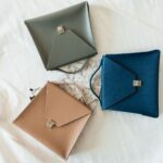 Neutral accessories arranged as an edited collection
