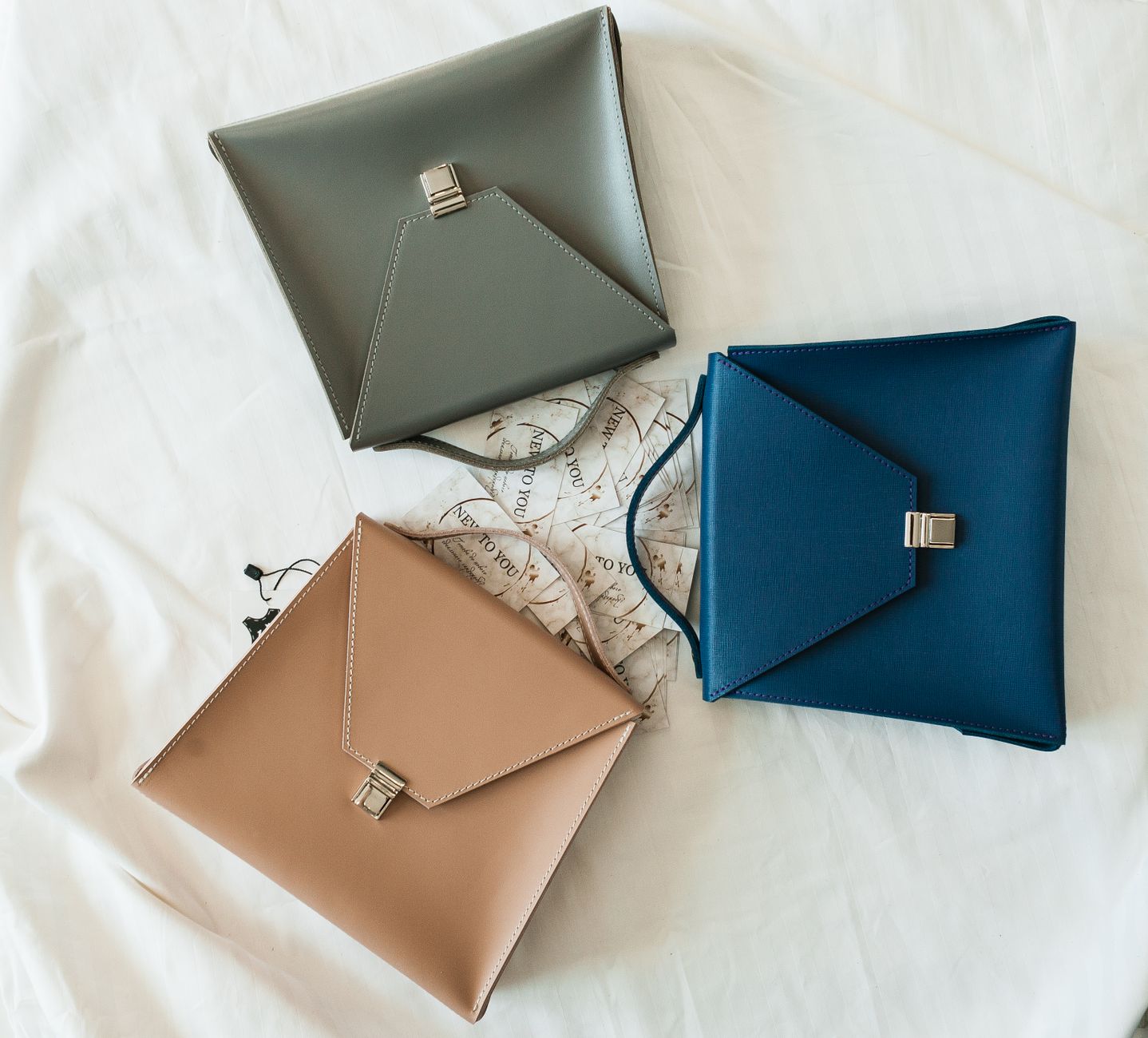 Neutral accessories arranged as an edited collection