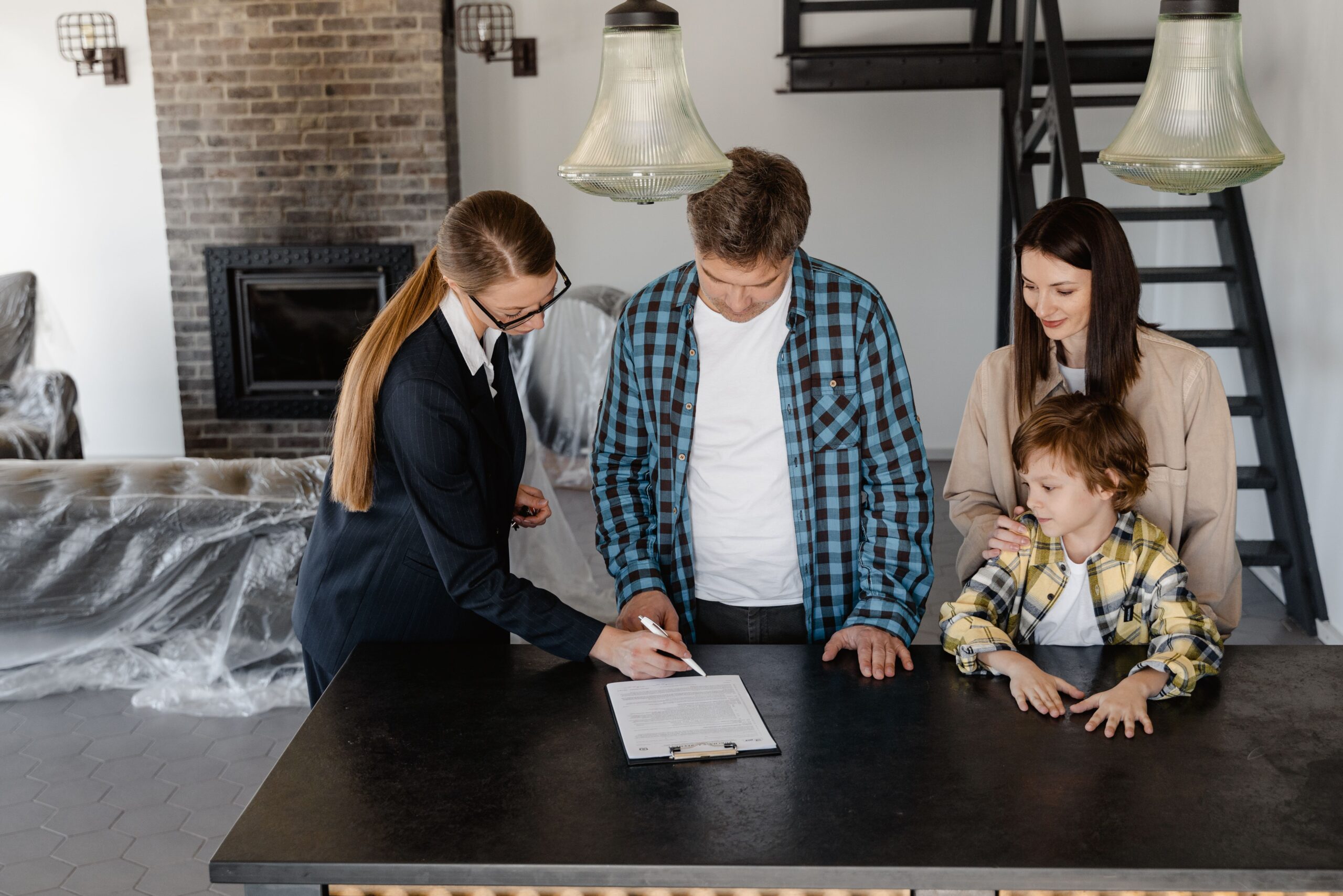 Family reviewing service paperwork before work begins