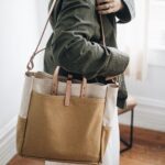 Canvas and leather market tote in a warm minimalist interior
