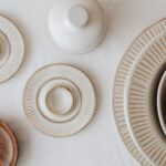 Neutral ceramic plates arranged on soft cotton cloth